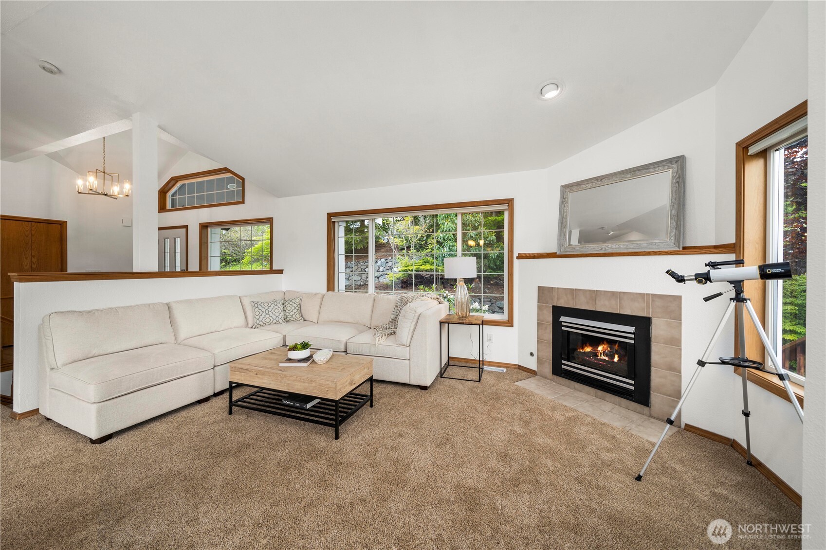 183 Dow Ridge Drive North Eatonville, WA 98328 - Photo 8 of 40 a living room with furniture a fireplace and a flat screen tv