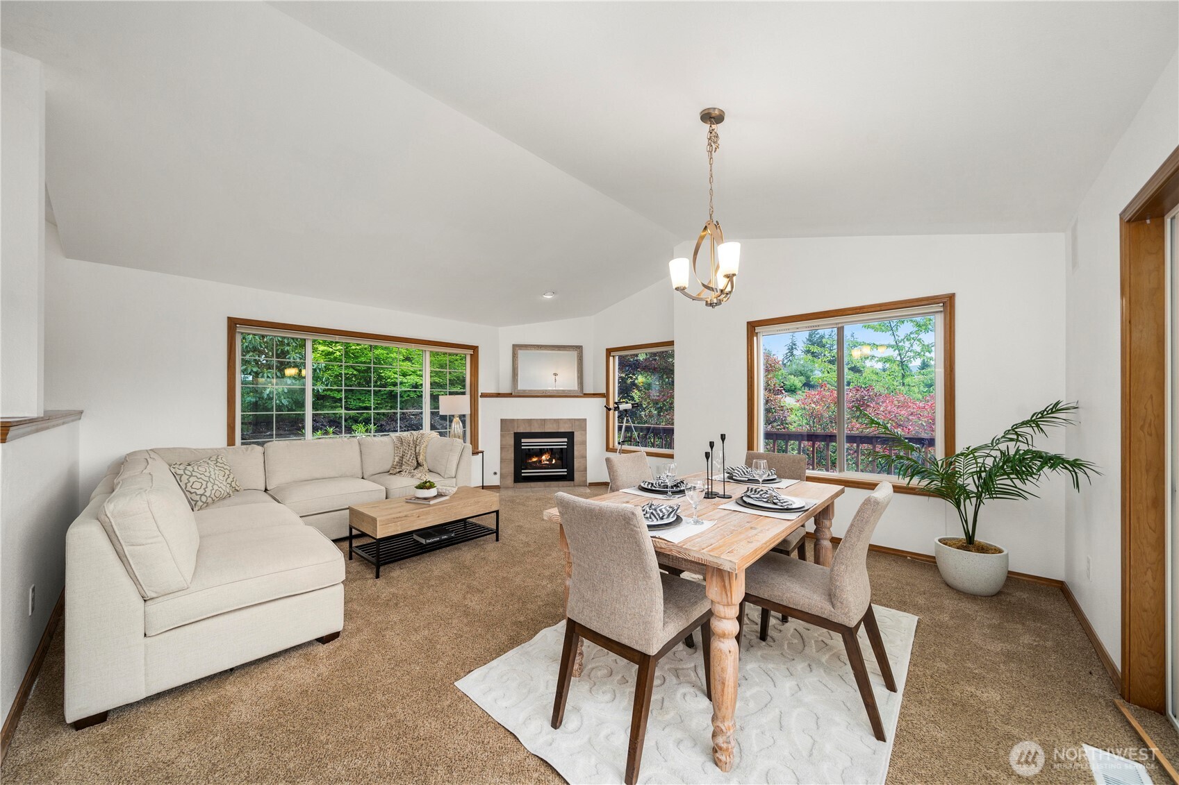 183 Dow Ridge Drive North Eatonville, WA 98328 - Photo 9 of 40 a living room with furniture a fireplace and a chandelier