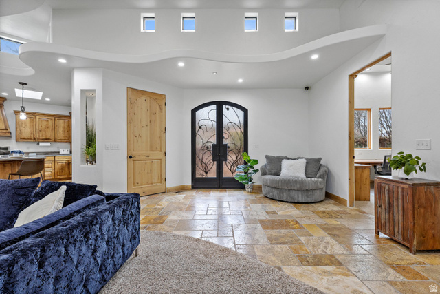 98 Bridge Road Rockville, UT 84763 - Photo 7 of 75 Foyer entrance with recessed lighting, stone tile floors, a high ceiling, and french doors