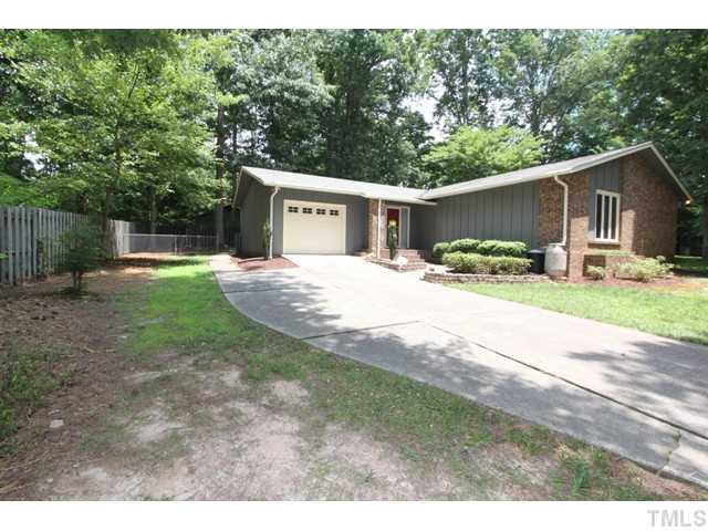 8616 Brandon Station Road Raleigh, NC 27613 - Photo 2 of 18 a front view of a house with yard and green space