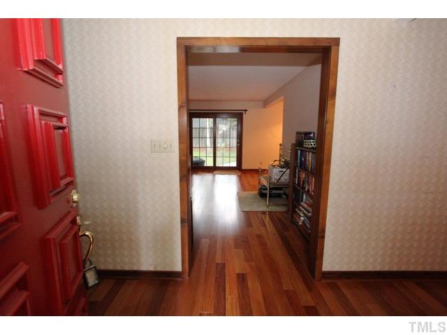 8616 Brandon Station Road Raleigh, NC 27613 - Photo 3 of 18 a view of a hallway and wooden floor