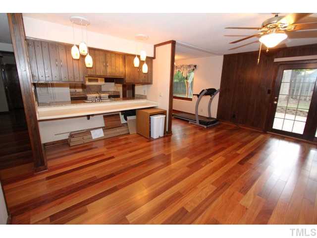 8616 Brandon Station Road Raleigh, NC 27613 - Photo 10 of 18 a view of kitchen with cabinets and wooden floor