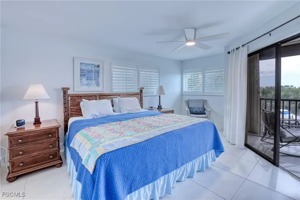 a bedroom with a bed and a night stand