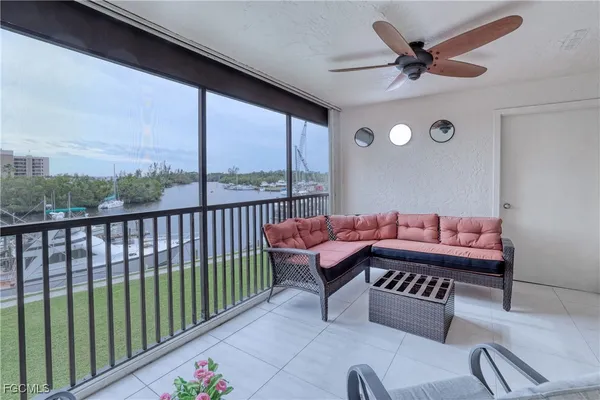 a outdoor living space with furniture and a floor to ceiling window