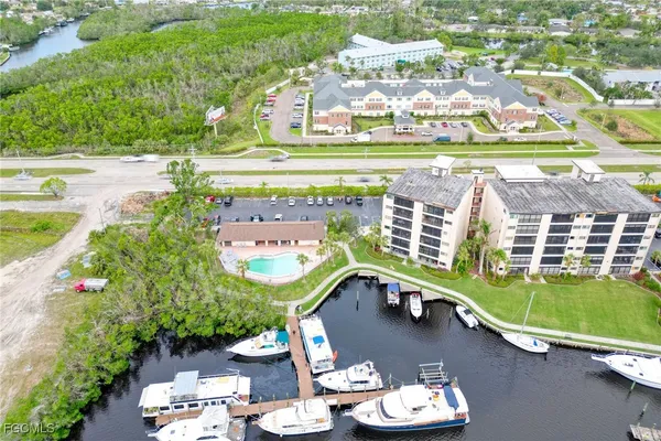 an aerial view of a house with a swimming pool patio and outdoor seating