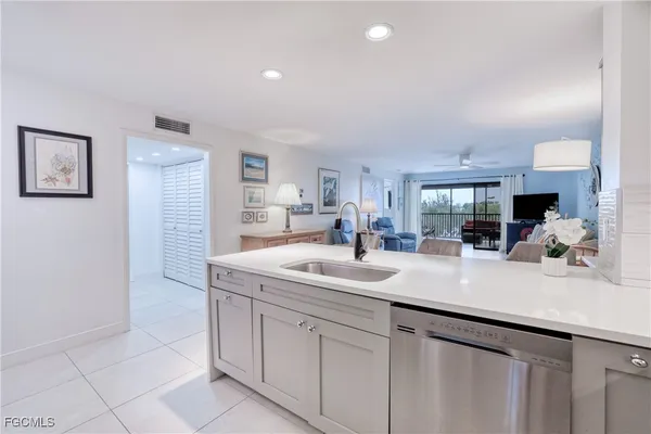 a kitchen with a sink and cabinets