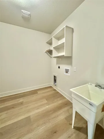 a spacious bathroom with a granite countertop sink mirror and shower