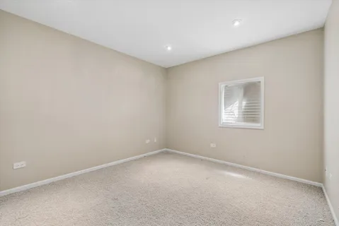 an empty room with a empty space and windows