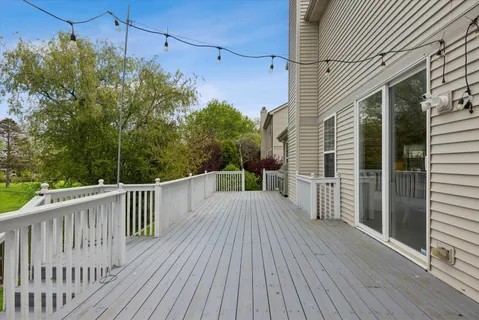 a view of a balcony with wooden floor