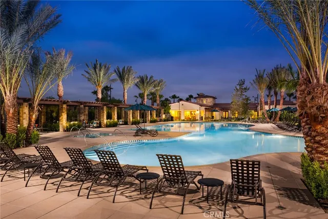 a view of swimming pool with outdoor seating