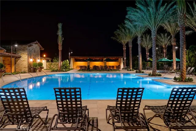swimming pool view with a outdoor seating