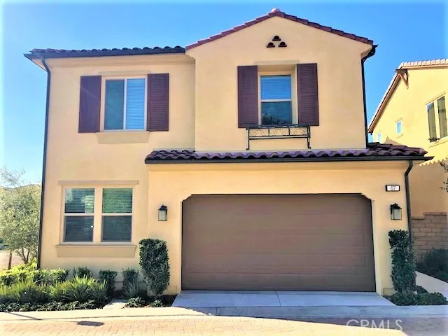 a front view of a house with garage