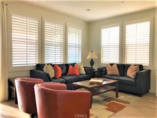 a living room with furniture and windows