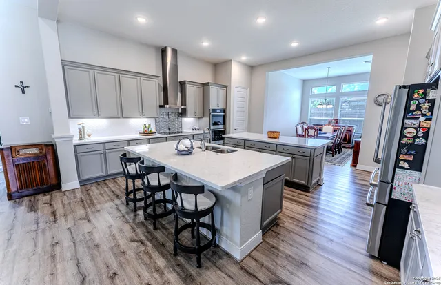 a view of a dining room with furniture and wooden floor