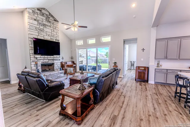 a living room with fireplace furniture and a flat screen tv
