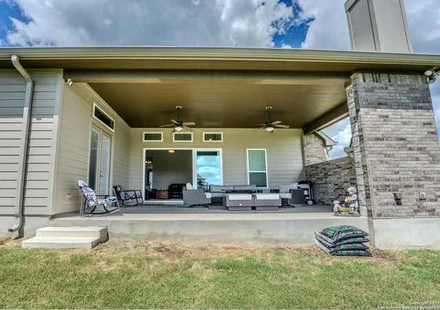 a view of swimming pool with outdoor seating