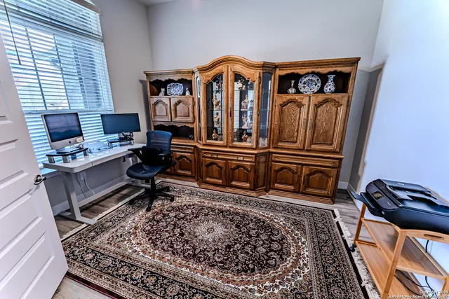 a living room with furniture and a rug