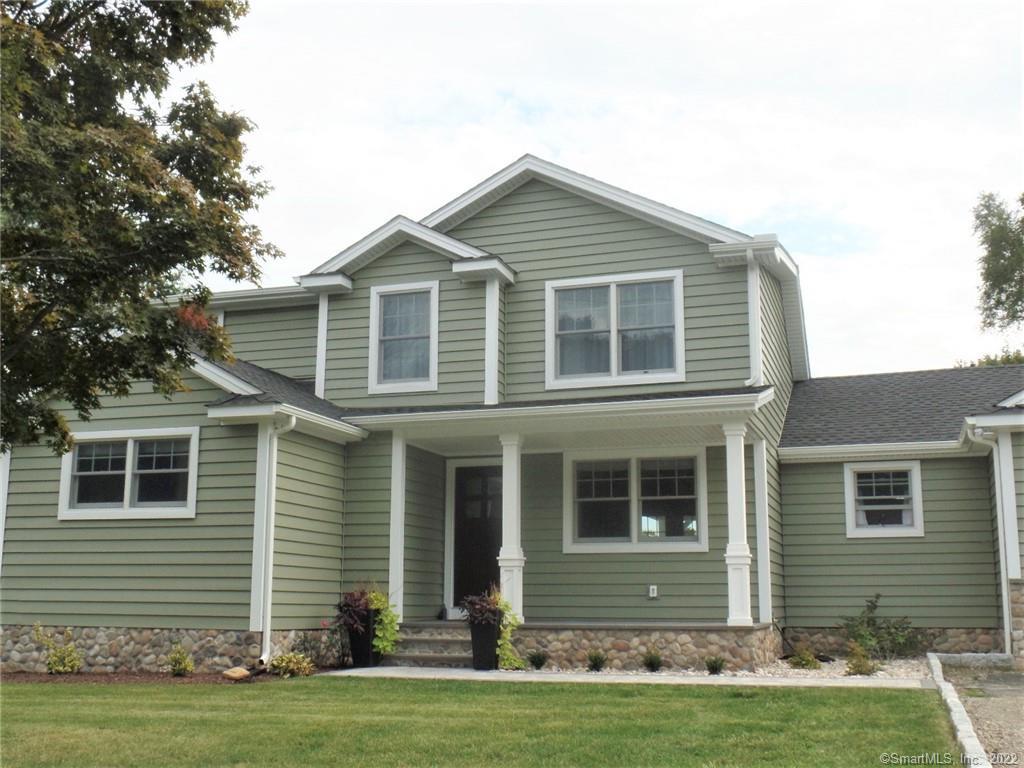 11 Shelbourne Road Trumbull, CT 06611 - Photo 1 of 1 a front view of a house with a yard