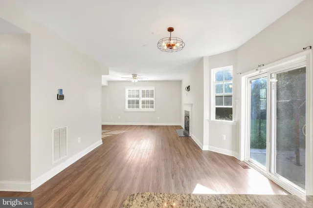 a view of a kitchen with wooden floor