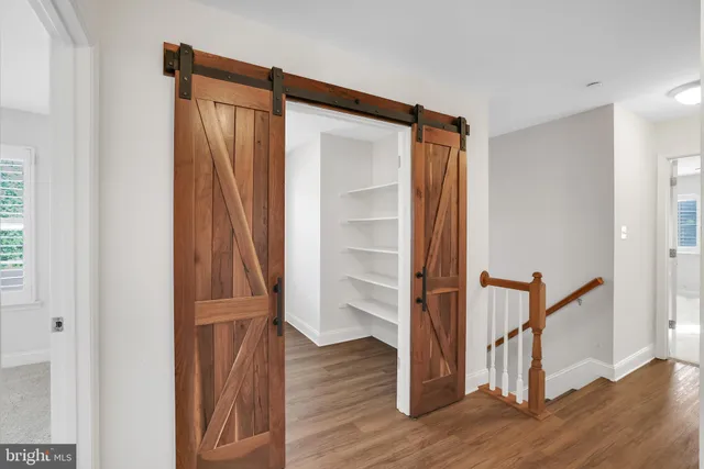 a bathroom with a sink toilet vanity and shower