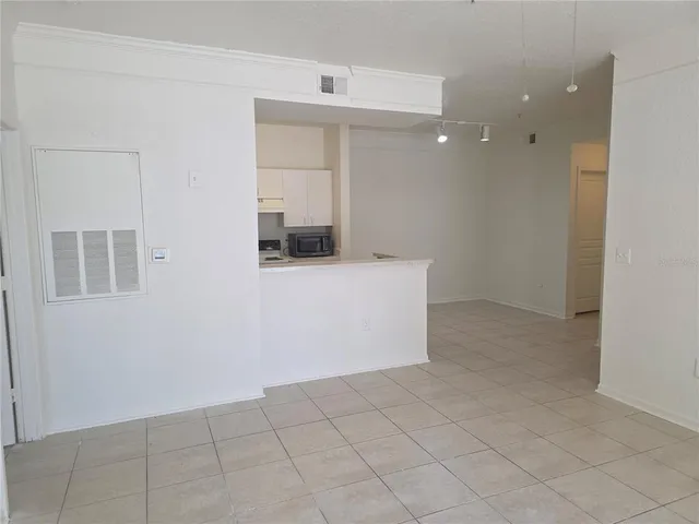 a kitchen with kitchen island a sink appliances and cabinets