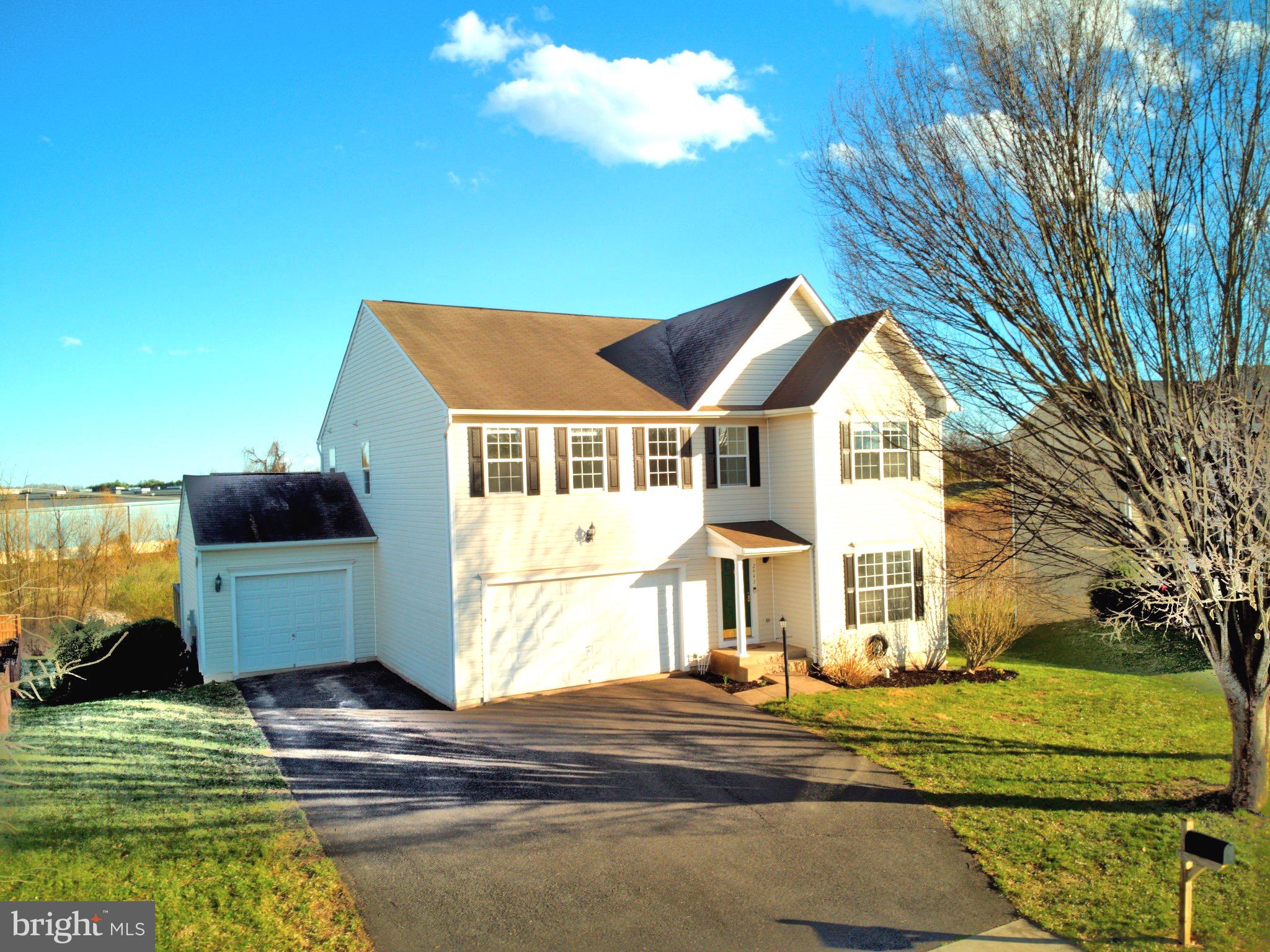 2443 Post Oak Drive Culpeper, VA 22701 - Photo 1 of 48 a front view of a house with a garden