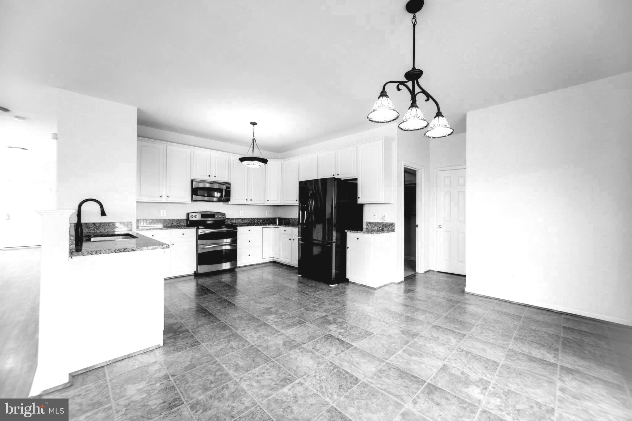 2443 Post Oak Drive Culpeper, VA 22701 - Photo 7 of 48 a view of a kitchen with microwave and stove