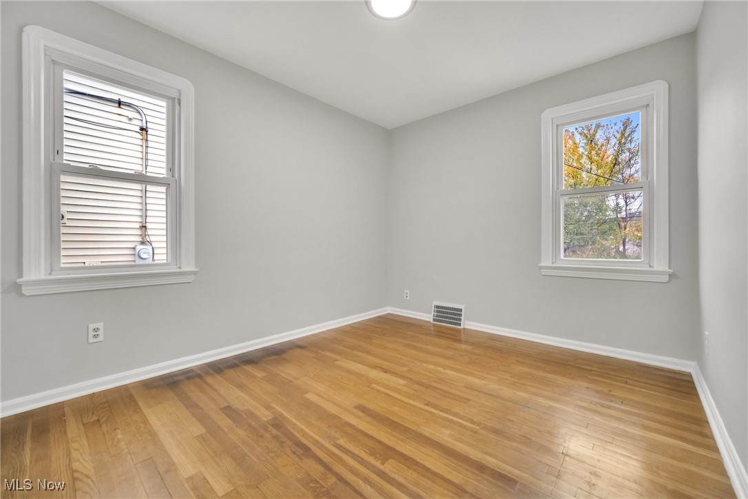 12910 Rockside Road Cleveland, OH 44125 - Photo 16 of 34 Spare room featuring hardwood / wood-style flooring