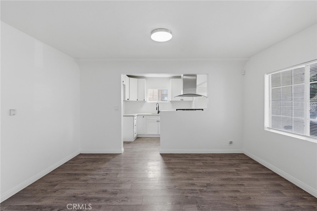 1311 West R Street Wilmington, CA 90744 - Photo 15 of 65 a view of a kitchen with wooden floor and windows