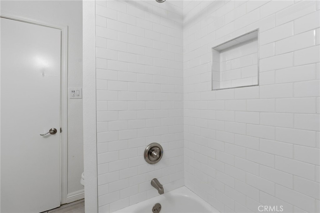 1311 West R Street Wilmington, CA 90744 - Photo 34 of 65 a bathroom with a bathtub