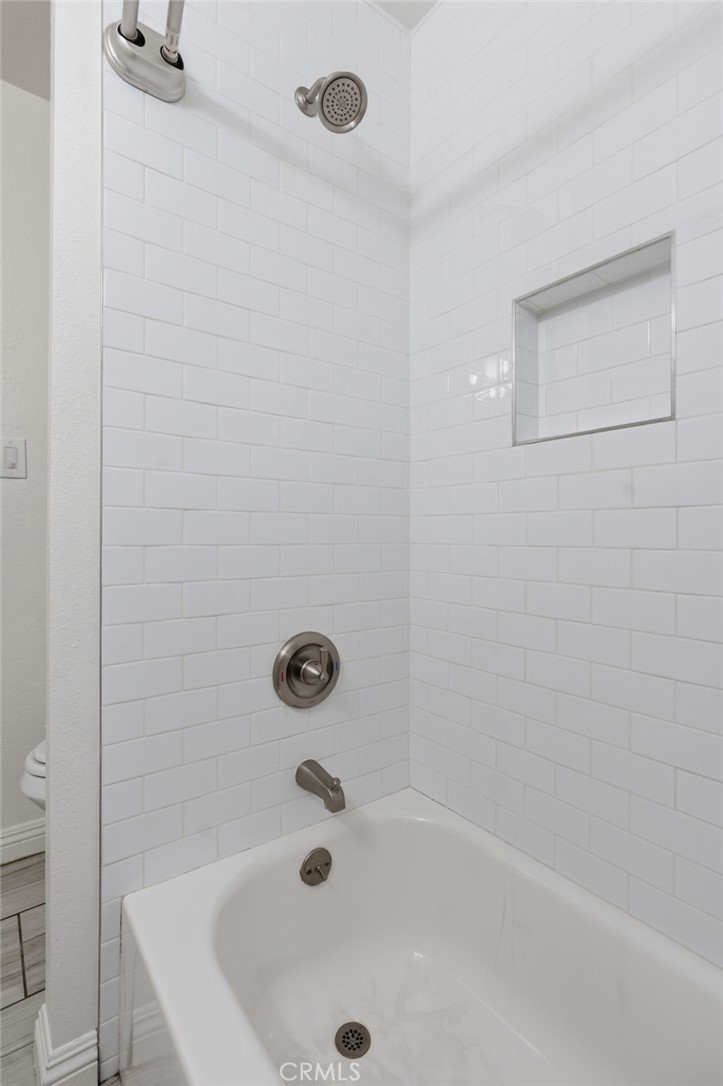 1311 West R Street Wilmington, CA 90744 - Photo 35 of 65 a bathroom with a tub