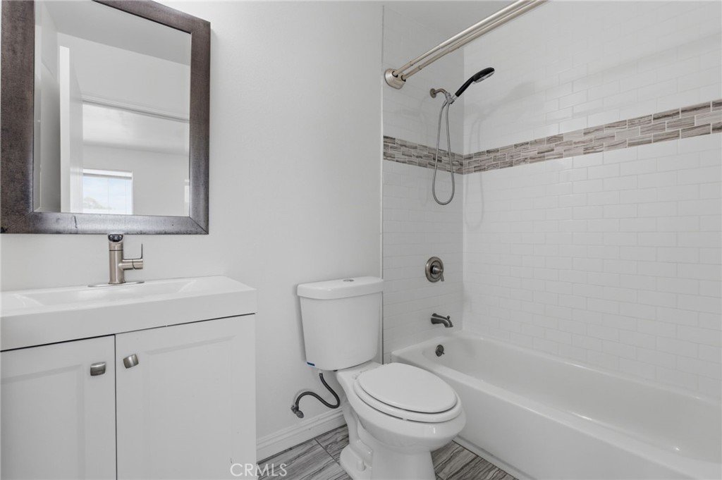 1311 West R Street Wilmington, CA 90744 - Photo 46 of 65 a bathroom with a sink toilet and shower