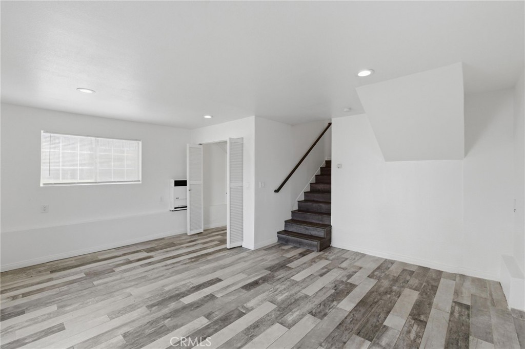 1311 West R Street Wilmington, CA 90744 - Photo 49 of 65 a view of a room with wooden floor and stairs