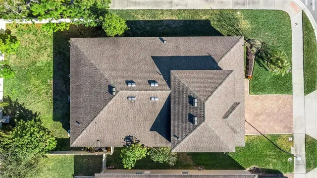 an aerial view of residential houses with outdoor space