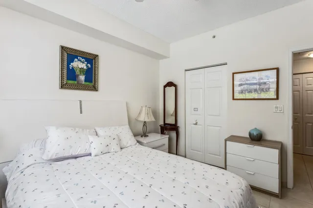 a bedroom with a bed and a desk