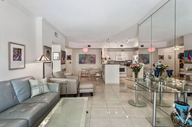 a living room with lots of furniture and white appliances
