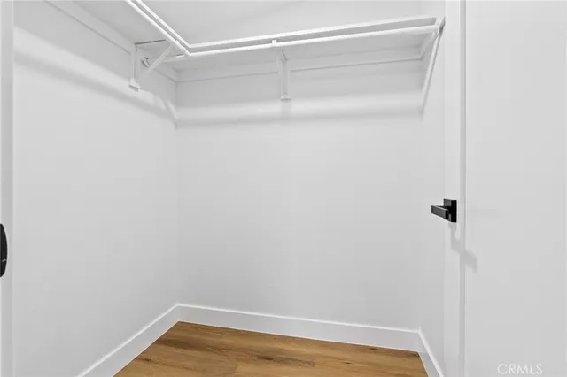 a view of an empty room with glass door