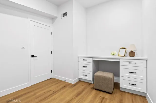 a bedroom with a bunk bed and a dresser