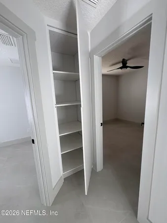 a view of an empty walk in closet