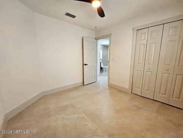a bathroom with a sink a toilet a mirror and bathtub