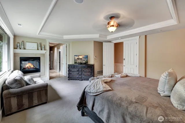 a bedroom with furniture and a fireplace