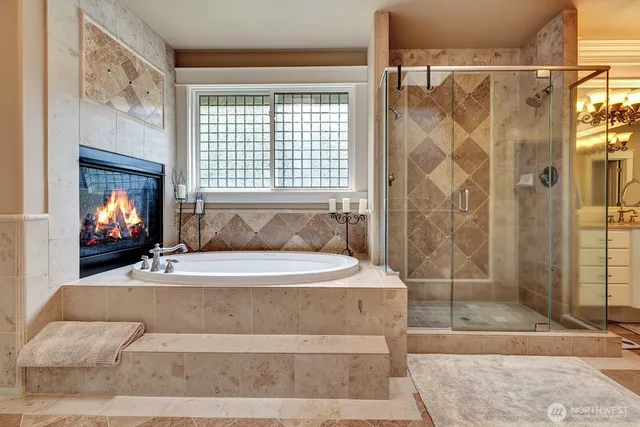 a spacious bathroom with a bathtub and shower