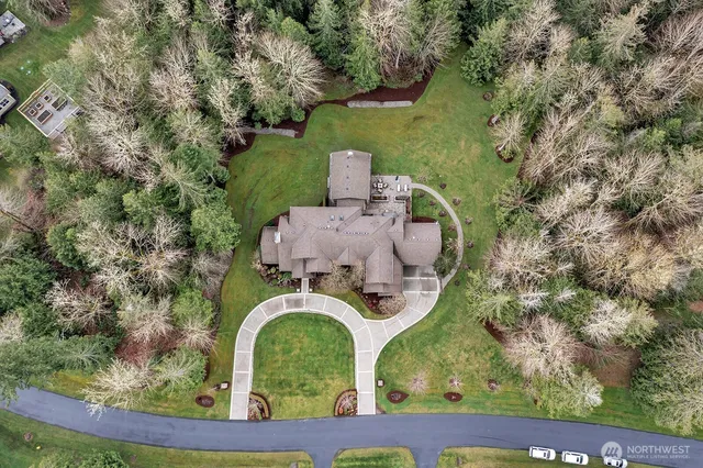 an aerial view of a house with outdoor space