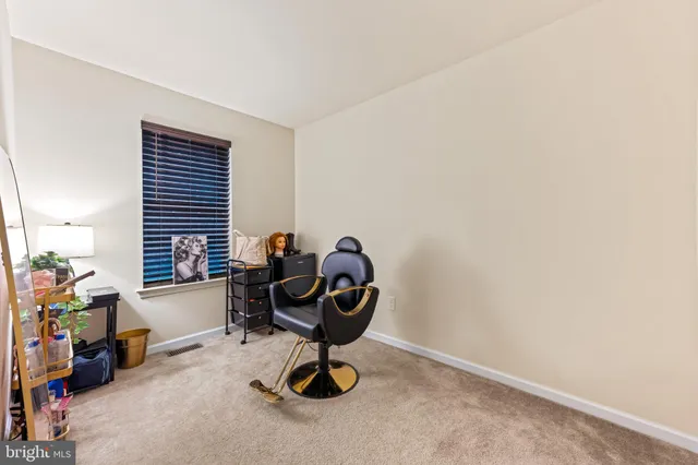 a view of a workspace with furniture