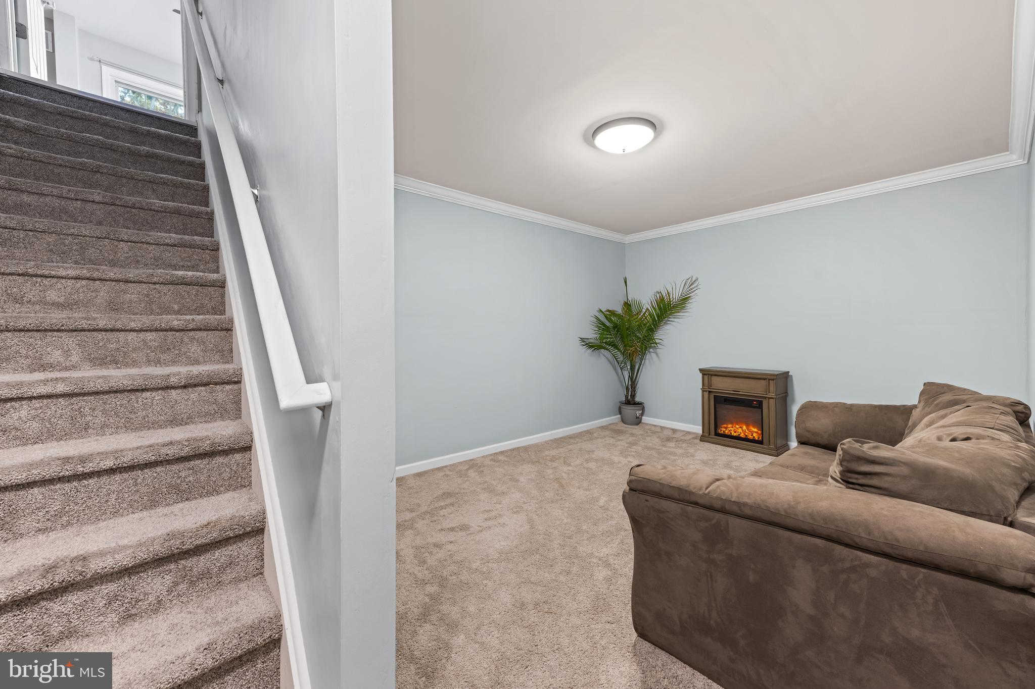 108 Nottingham Lane Newfield, NJ 08344 - Photo 38 of 39 a living room with furniture and a potted plant