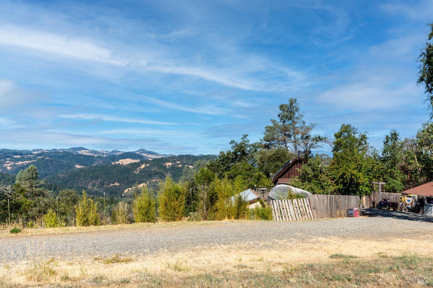 34010 Shimmins Ridge Road Willits, CA 95490 - Photo 28 of 38 a view of road with a building in the background