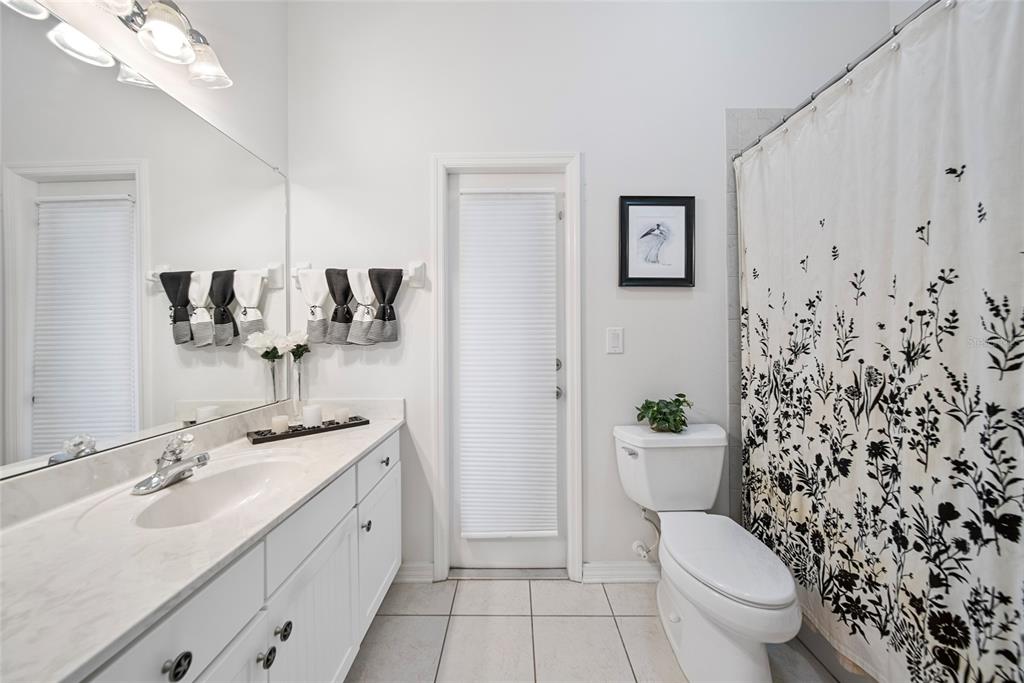 11729 Newberry Grove Loop Riverview, FL 33579 - Photo 31 of 42 a bathroom with a toilet sink and mirror