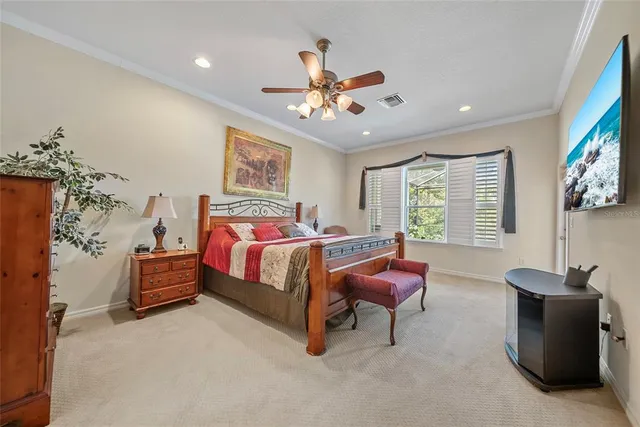 a bedroom with bed and window