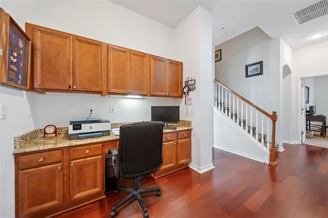 a view of a kitchen with electric appliances and cabinets