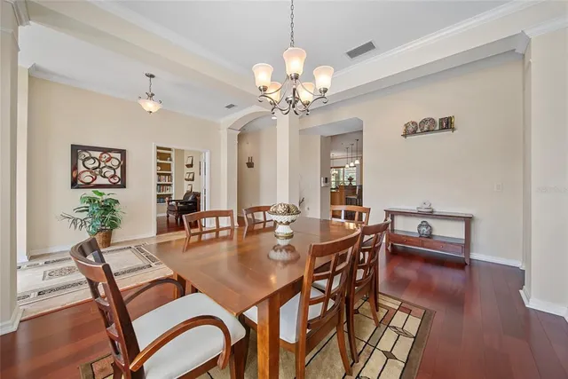 a dining room with furniture and window